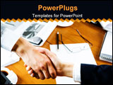 PowerPoint Template - Business people�s handshake over table with business objects on it