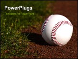 PowerPoint Template - Baseball on the green grass and red dirt of a ball field