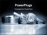 PowerPoint Template - Wedding rings stacked on a reflective surface.