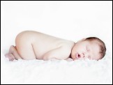 PowerPoint Template - Newborn baby sleeping. Soft focus, shallow DoF.